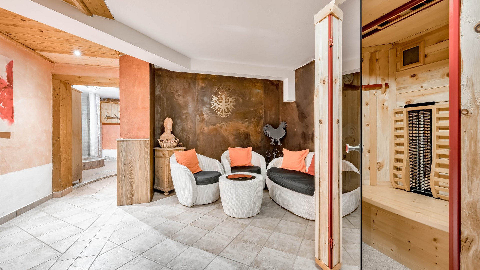 Relax & unwind • Der Grubacher: Eco Hotel in Gerlos Wellness area with infrared cabin and seating area